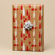 Gordon's kraft wine gift box with silver bow, isolated on a neutral background